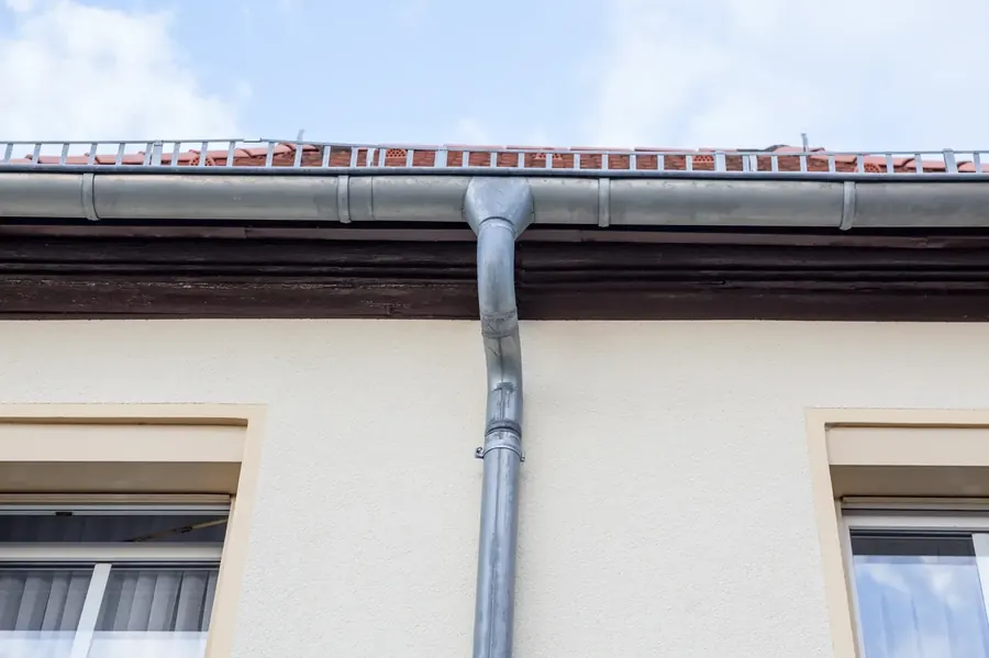 House with gutter downspout